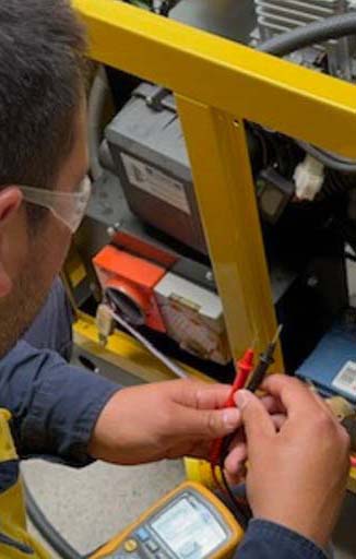 Student working on a Gas Stationary Engine